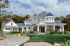 a large white house with lots of windows on it's front porch and landscaping