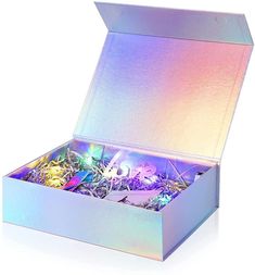 an open box filled with lots of different types of confetti and candies