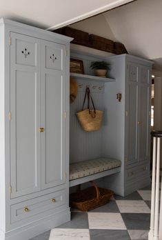 a room with some cupboards and baskets on it