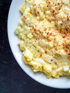 a white plate topped with macaroni and cheese