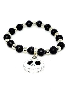 Jack Skellington beaded stretch bracelet. Handcrafted. Jewelry pouch included for gift giving. Will fit most mid size wrists. Bracelets Ideas, Mid Size, Beaded Stretch Bracelet, Jack Skellington, Jewelry Pouch, Stretch Bracelet, Gift Giving, Stretch Bracelets, Arm Band