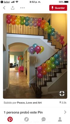 balloons are floating down the stairs in this house