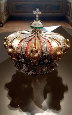 an ornate crown is sitting on a table