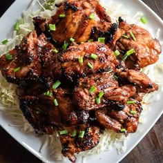 a white plate topped with chicken and rice