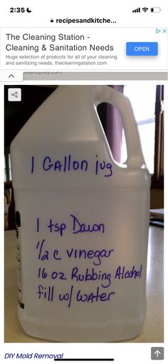 a plastic jug with writing on it sitting on a table