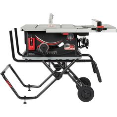 a portable table sawing machine sitting on top of a cart with wheels attached to it