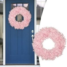 a blue door with a pink wreath on it