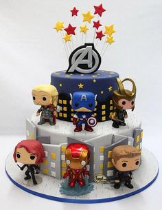 the avengers birthday cake is decorated with figurines