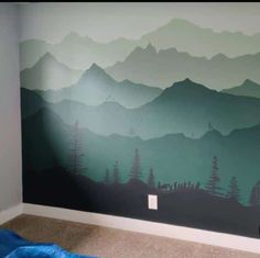 a room with mountains painted on the wall