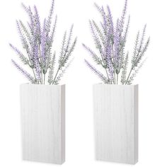 two white vases with purple flowers in them on a white background, side by side