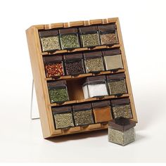 a wooden spice rack filled with lots of spices