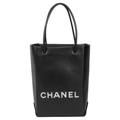 CHANEL Black & White Lambskin Mini Shopping Bag Tote Serial Number: 12792574 Age (Circa): 2008 Accompanied By: Chanel Dust Bag, Authenticity Card, Care Booklet Authenticity Details: Authenticity Card, Serial Sticker (Made in Italy) Gender: Ladies Type: Tote, Shopper Colour: Black, White Hardware: Silver Material(s): Lambskin Leather Interior: Patterned Textile Closure: Open Top Height: 21cm Width: 14cm Depth: 8cm Handle Drop: 11cm -The exterior is in excellent condition with minimal signs of use Classic Evening Bags With Logo, Leather Shoulder Bag With Logo For Errands, Designer Shopping Bags With Logo, Modern Evening Bags With Logo, Luxury Black Box Bag For Errands, Classic Everyday Bag With Logo, Classic Everyday Bags With Logo, Designer Bags With Logo For Errands, Top Handle Shoulder Bag With Logo For Shopping