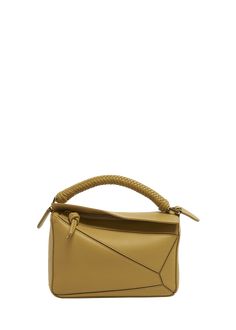 "Find LOEWE Small Puzzle Leather Top-handle Bag on Editorialist. Loewe top handle bag in puzzle leather and cotton Top handle Detachable, adjustable logo shoulder strap Can be worn as a top handle or shoulder bag Fold-over flap top with zip closure Approx. 6.4\"H x 9.4\"W x 4.1\"D Made in Spain" Loewe Top, Loewe Puzzle Bag, Loewe Puzzle, Puzzle Bag, Faux Leather Top, Pearl Leather, Bags Logo, Woven Pattern, Pearl Grey