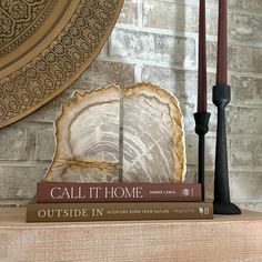 These Indonesian petrified wood bookends are crafted from unique wood that's been petrified over millions of years. Their natural beauty and solid weight make them the perfect accents for your favorite books. Their timeless, organic look will add a touch of natural beauty to any home or office space. Set of 2 bookends. Bookends are polished on both sides and feature a natural bark edge. Dimensions (measured end to end) : 6.5" L x 2.25"W x 7.5"H Modern Rustic Office Decor, Modern Rustic Office, Rustic Office Decor, Bark Edge, Agate Bookends, Wood Bookends, Rustic Office, Wood Serving Board, Marble Tray