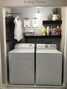 a washer and dryer in a laundry room with shelves on the wall above them