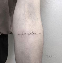 a woman's arm with the word family written in cursive handwriting