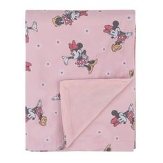 a pink blanket with mickey mouse on it