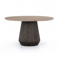 a wooden table with a round top and two small circular bases on the base are dark wood