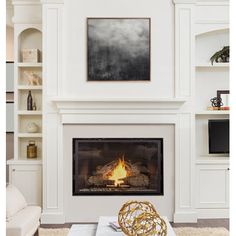 a white living room with a fire place