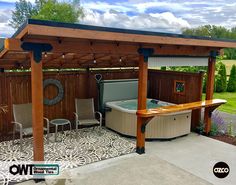 an outdoor hot tub in the middle of a patio