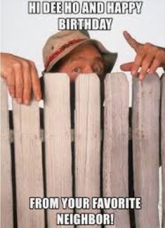 a man peeking over the top of a wooden fence with his hand on it's head