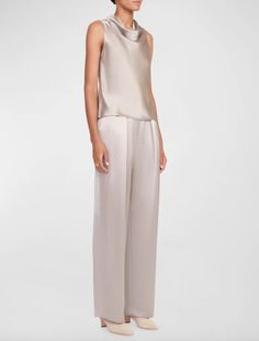 Our signature pant updated in a satin fabric with a silver lamé finish. the luisa is a wide leg pleated trouser with hook and zip closure.  - s: 70% silk 30% metallic plain    - model is 5'10" and wearing a size 2    - dry clean only Sleek Silk Wide Leg Pants, Chic Spring Bottoms With Sheen, Chic Sheen Bottoms For Spring, Chic Spring Sheen Bottoms, Sleek Silk Pants For Spring, Elegant Sheen Bottoms For Party, Elegant Party Bottoms With Sheen, Elegant Satin Wide Leg Pants For Spring, Silver Elegant Evening Bottoms