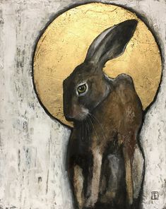 a painting of a brown rabbit sitting in front of a yellow moon on a white wall