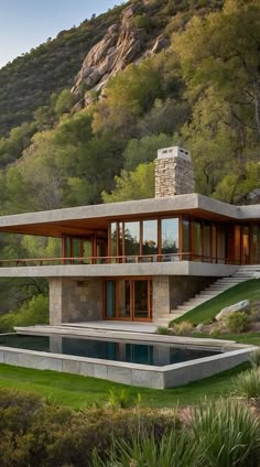 a modern house in the mountains with a pool