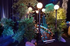 a set of stairs with lights and plants