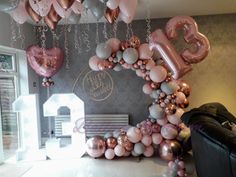 balloons are hanging in the shape of letters and numbers