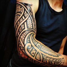 a man with a tattoo on his arm