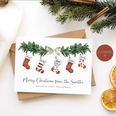 a christmas card with stockings and orange slices