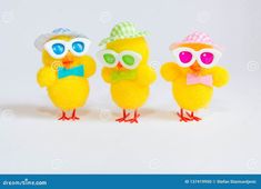 three little yellow chicks wearing sunglasses and hats