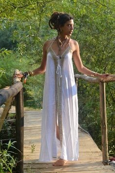 Boho maxi dressOur elegant, flowing Boho Infinity dress is in white withe gold aplique  back in stock finally A Gypsy dress with style and sophistication. Made from Rayon (a wood based fabric) with stunning intricate natural hemp applique. This is definitely a Hippie dress with style. It is for DRY CLEAN only .My love for Alternative clothing in a kind of Hippie clothes style is obvious here , fusing Bohemian with class. This Loose maxi dress is ideal for evening out and looking stunning at part Promenade Dress, Pagan Clothing, Dress Alternative, Pixie Dress, Maxi Dress Designs, Hippie Dress, Hippie Clothes, Loose Maxi Dress, Bohemian Maxi Dress