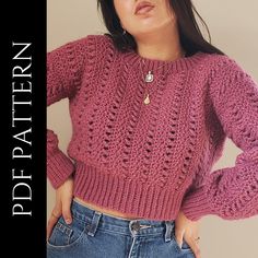 a woman wearing a pink sweater and jeans