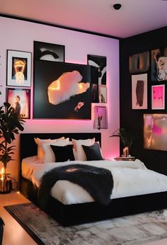 a black and white bedroom with pictures on the wall