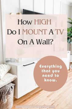 the words how high do i mount a tv on a wall? in front of a white cabinet