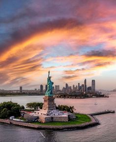 the statue of liberty stands on an island in new york city's lower east side