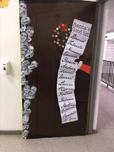 the door to santa's good list is decorated with paper