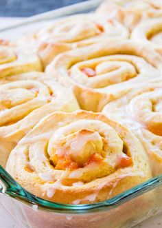 a glass baking dish filled with cinnamon rolls