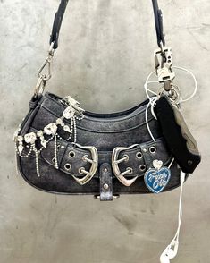 100% Faux leather Buckle statement bag Top zipper closure Measurement approx. 10.25"x 6"x 2.25" Shoulder strap 43" Top handle strap 25" Buckle Bag, Conch Earring, Buckle Bags, Bow Bag, Statement Bag, Western Hats, Weekend Wear, Leather Buckle, Dainty Earrings