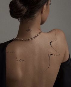 a woman with a tattoo on her back