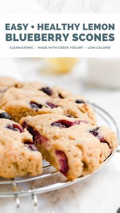 blueberry scones on a wire rack with lemons in the background