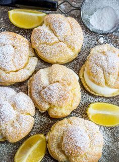 lemon cookies with powdered sugar and sliced lemons