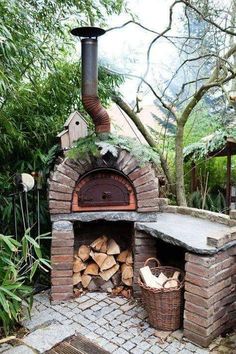 an outdoor brick pizza oven with logs in it