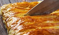 a knife is being used to cut the bread