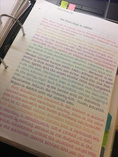 an open notebook with colorful writing on it