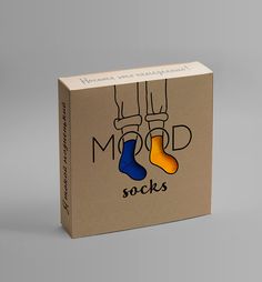 a cardboard box with two socks on the front and one in the back that says modd socks