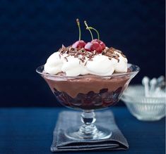 a dessert dish with chocolate and cherries in it