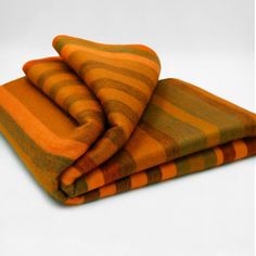 Snuggle into the comfort of the Putumayo Alpaca Wool Throw, arrayed with vertical stripes in rich, earthy tones of burnt orange and olive green, invoking the spirit of autumnal woodlands. This exquisite throw melds luxurious comfort with a touch of rustic elegance, perfect for enriching your home atmosphere or providing a cozy embrace on brisk nights. Masterfully crafted from the finest alpaca fibers, it delivers insulating warmth that is surprisingly lightweight, positioning it as your go-to throw for year-round indulgence.Please note that colors and shades may vary slightly from the photo, making each blanket a unique and special piece. This blanket measures approx. 96 x 68 inch / 243 x 172 cm Weight: 900 gr. Material: 80% alpaca 20% acrylic. The alpaca is a product of ancient Andean civ Alpaca Wool Blanket, Wool Throw Blanket, Sofa Throw Blanket, Alpaca Fiber, Wool Throw, Garden Bedding, Baby Alpaca, Alpaca Wool, Vertical Stripes